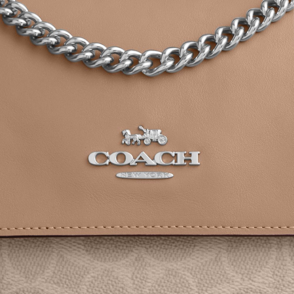 ELODIE CROSSBODY BAG IN SIGNATURE CANVAS