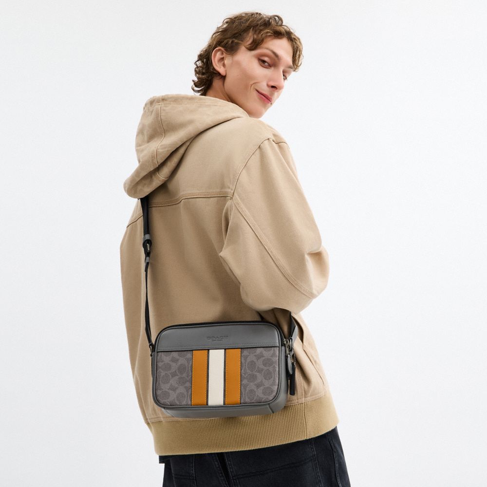 GRAHAM CROSSBODY BAG IN SIGNATURE CANVAS WITH VARSITY STRIPE