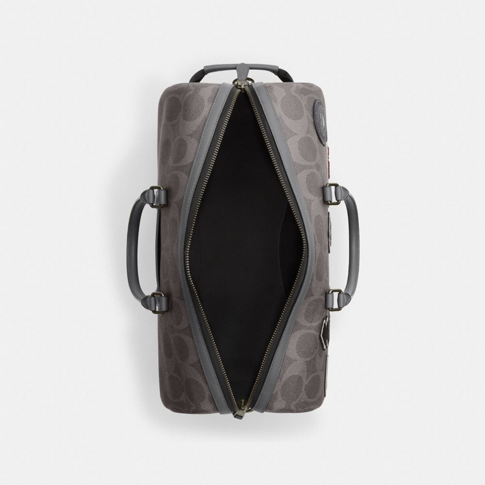 VENTURER BAG IN MAXI SIGNATURE CANVAS WITH PATCHES