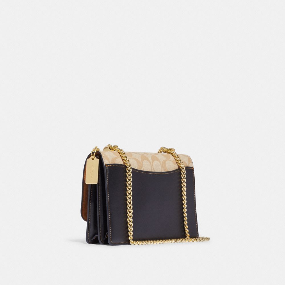 KLARE CROSSBODY IN BLOCKED SIGNATURE CANVAS