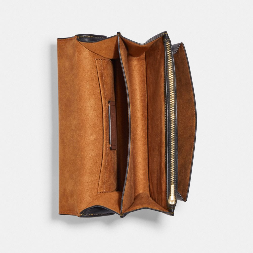 KLARE CROSSBODY IN BLOCKED SIGNATURE CANVAS