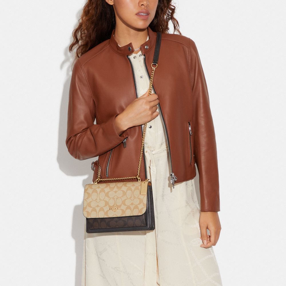 KLARE CROSSBODY IN BLOCKED SIGNATURE CANVAS