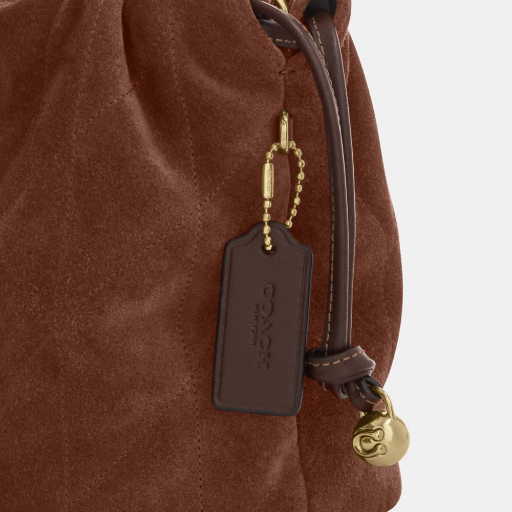 FAYE 絎縫細節迷你拉繩包