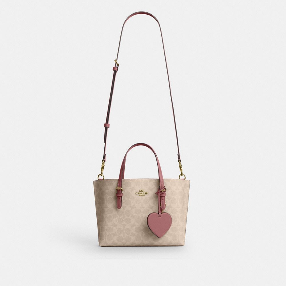 MOLLIE TOTE BAG 25 IN SIGNATURE CANVAS WITH HEART CHARM