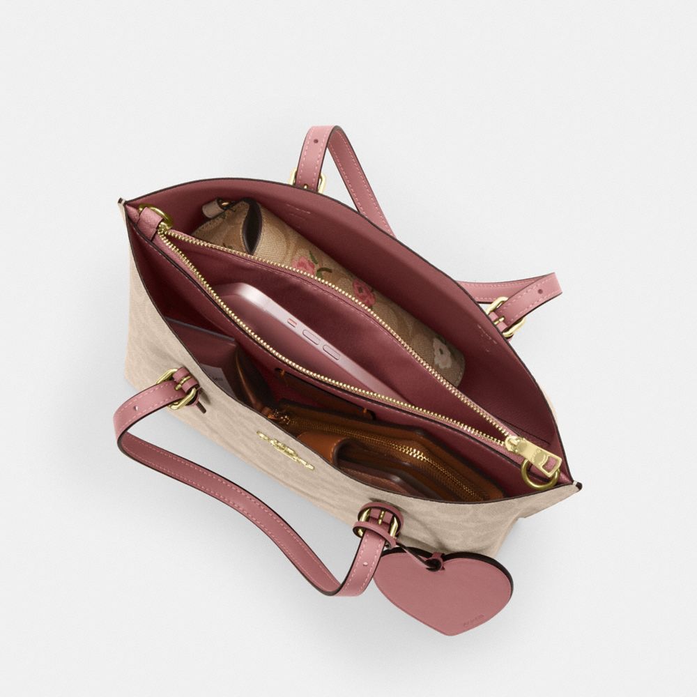 MOLLIE TOTE BAG 25 IN SIGNATURE CANVAS WITH HEART CHARM
