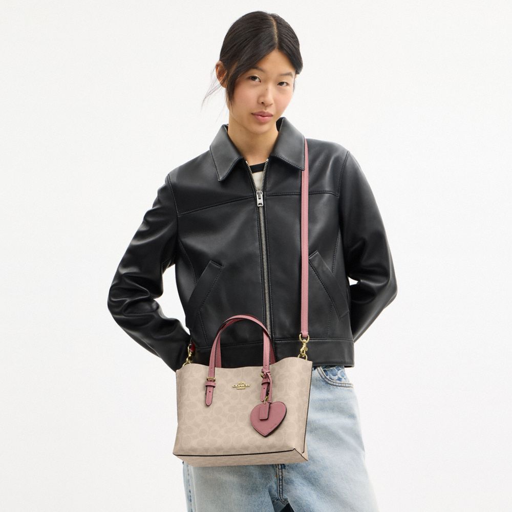 MOLLIE TOTE BAG 25 IN SIGNATURE CANVAS WITH HEART CHARM
