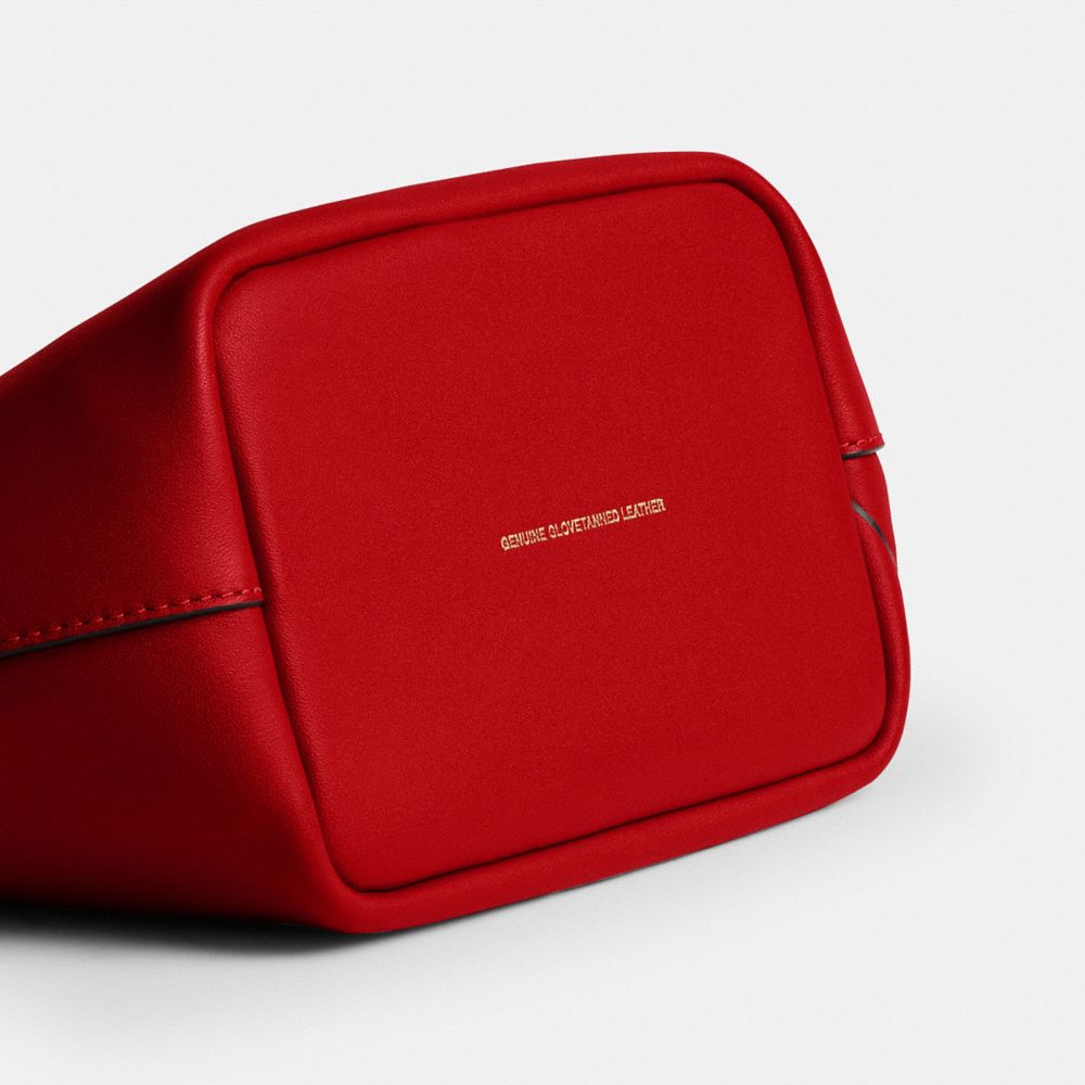 DISNEY X COACH 布魯托圖案 KISSLOCK FRAME 手袋