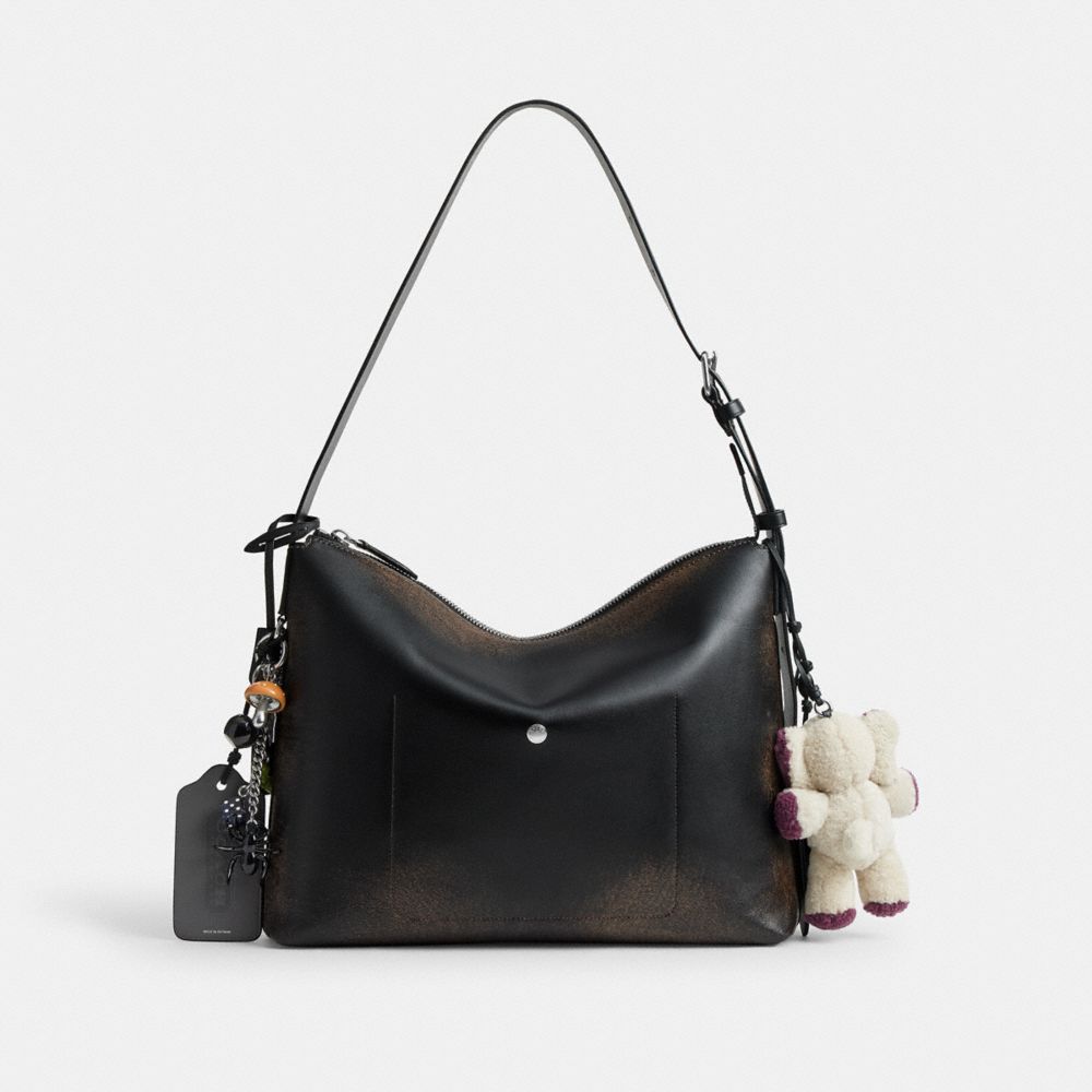 MOTT MESSENGER BAG 38 IN LOVED LEATHER WITH CHARMS