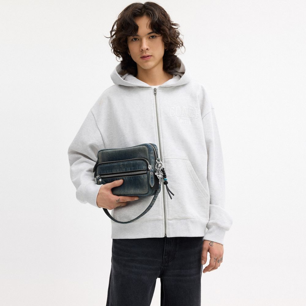 DAKOTA CROSSBODY BAG IN REGENERATIVE COTTON DENIM WITH CHARMS