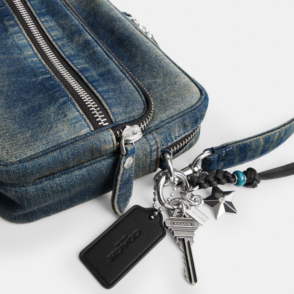 DAKOTA CROSSBODY BAG IN REGENERATIVE COTTON DENIM WITH CHARMS