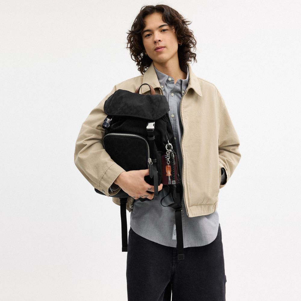 LOGAN BACKPACK IN SIGNATURE NYLON WITH CHARMS