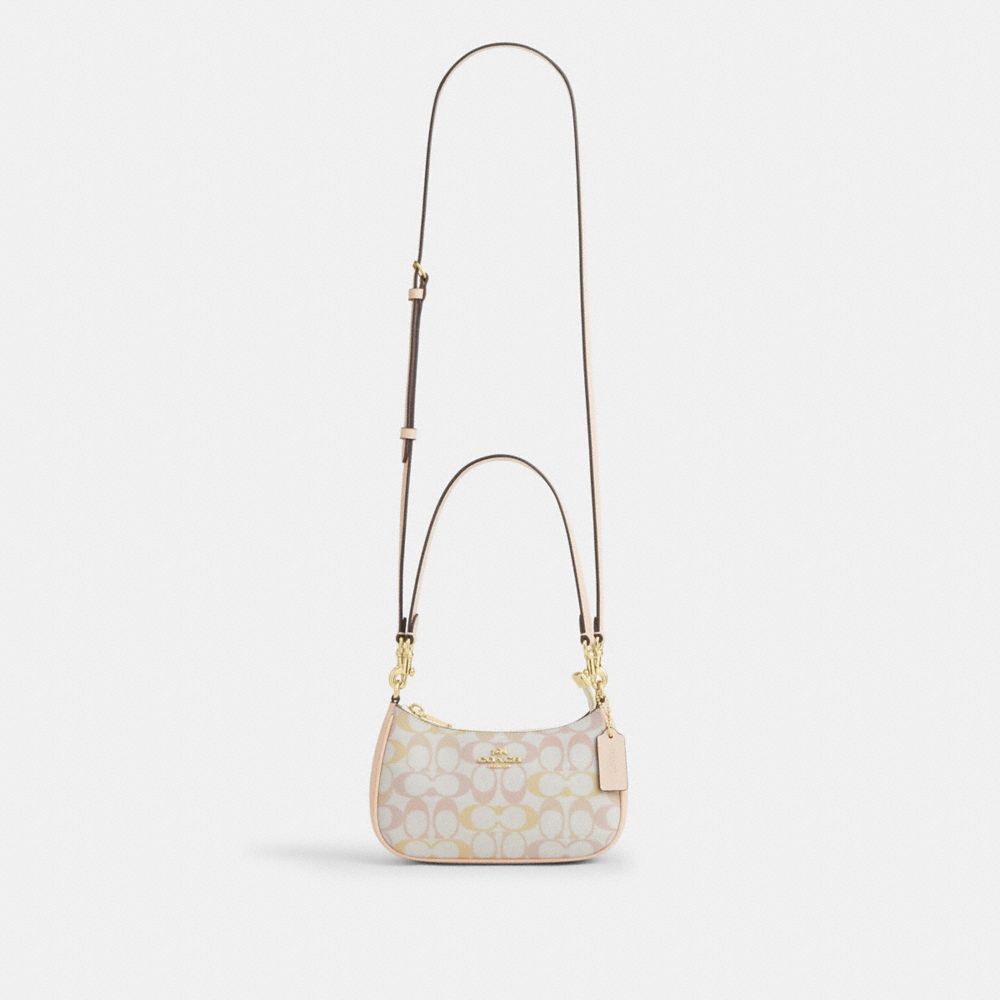 TERI MINI CROSSBODY BAG IN PRETTY SIGNATURE CANVAS