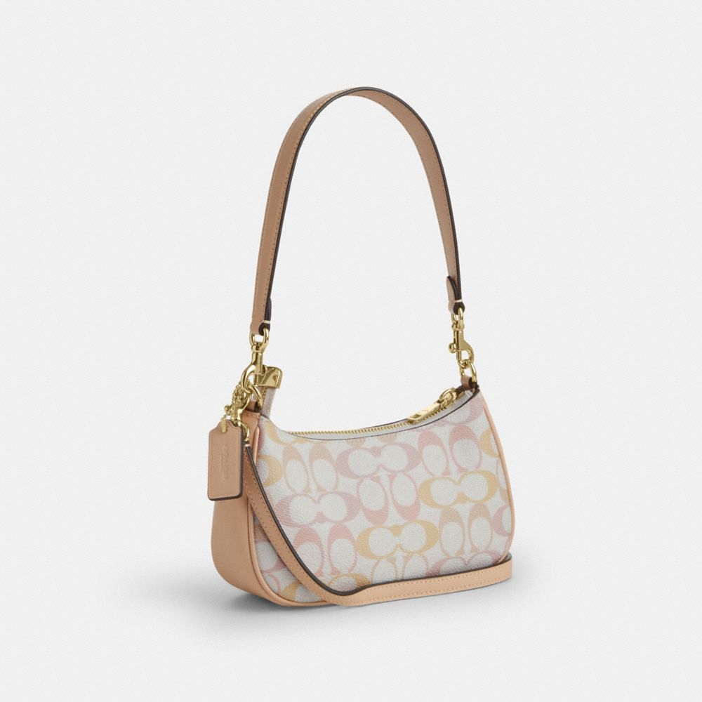 TERI MINI CROSSBODY BAG IN PRETTY SIGNATURE CANVAS