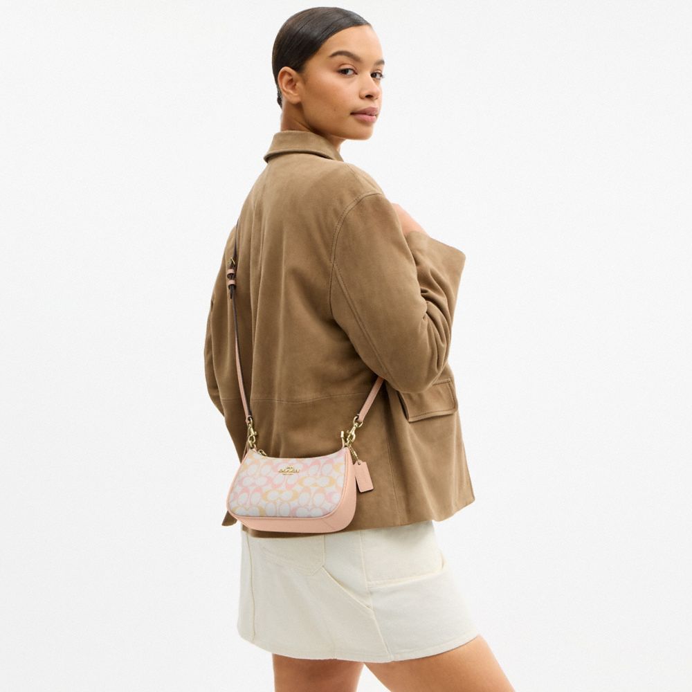 TERI MINI CROSSBODY BAG IN PRETTY SIGNATURE CANVAS