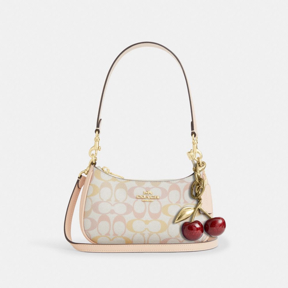 TERI MINI CROSSBODY BAG IN PRETTY SIGNATURE CANVAS