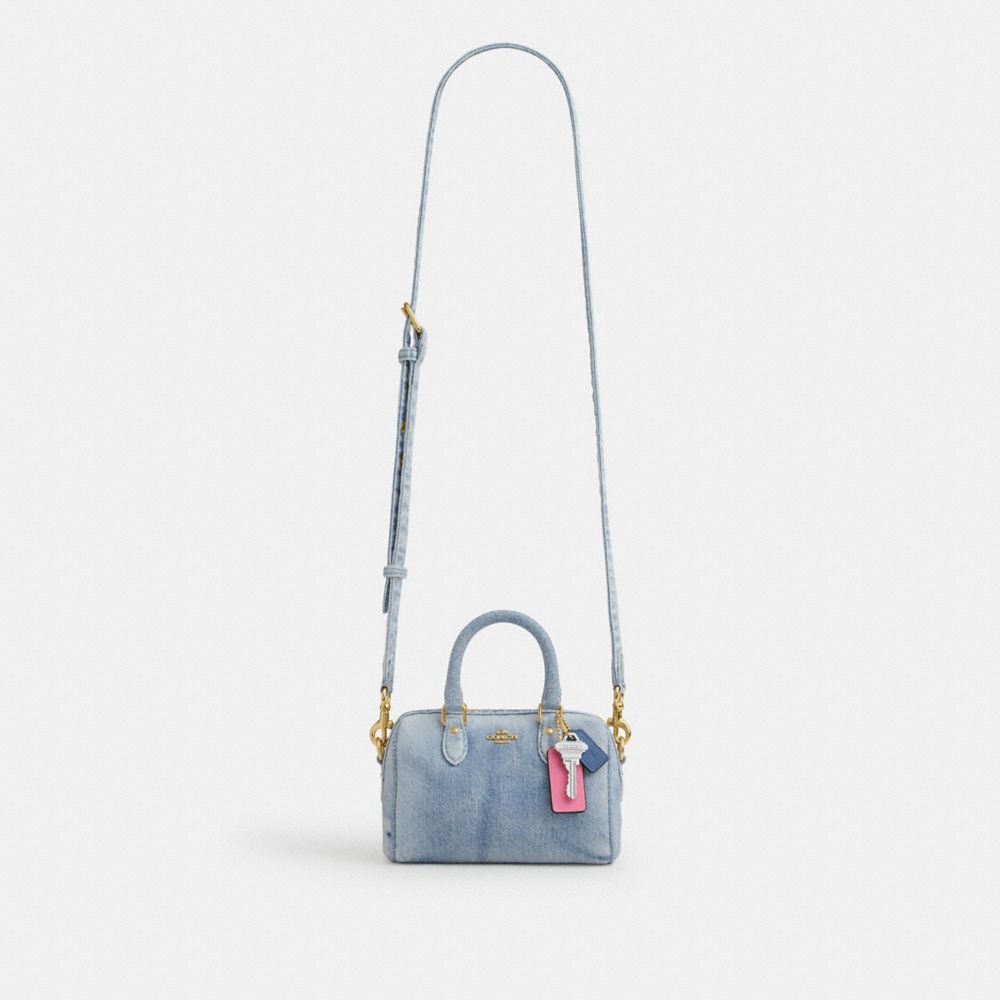 MINI ROWAN CROSSBODY BAG IN LOVED DENIM WITH CHARMS