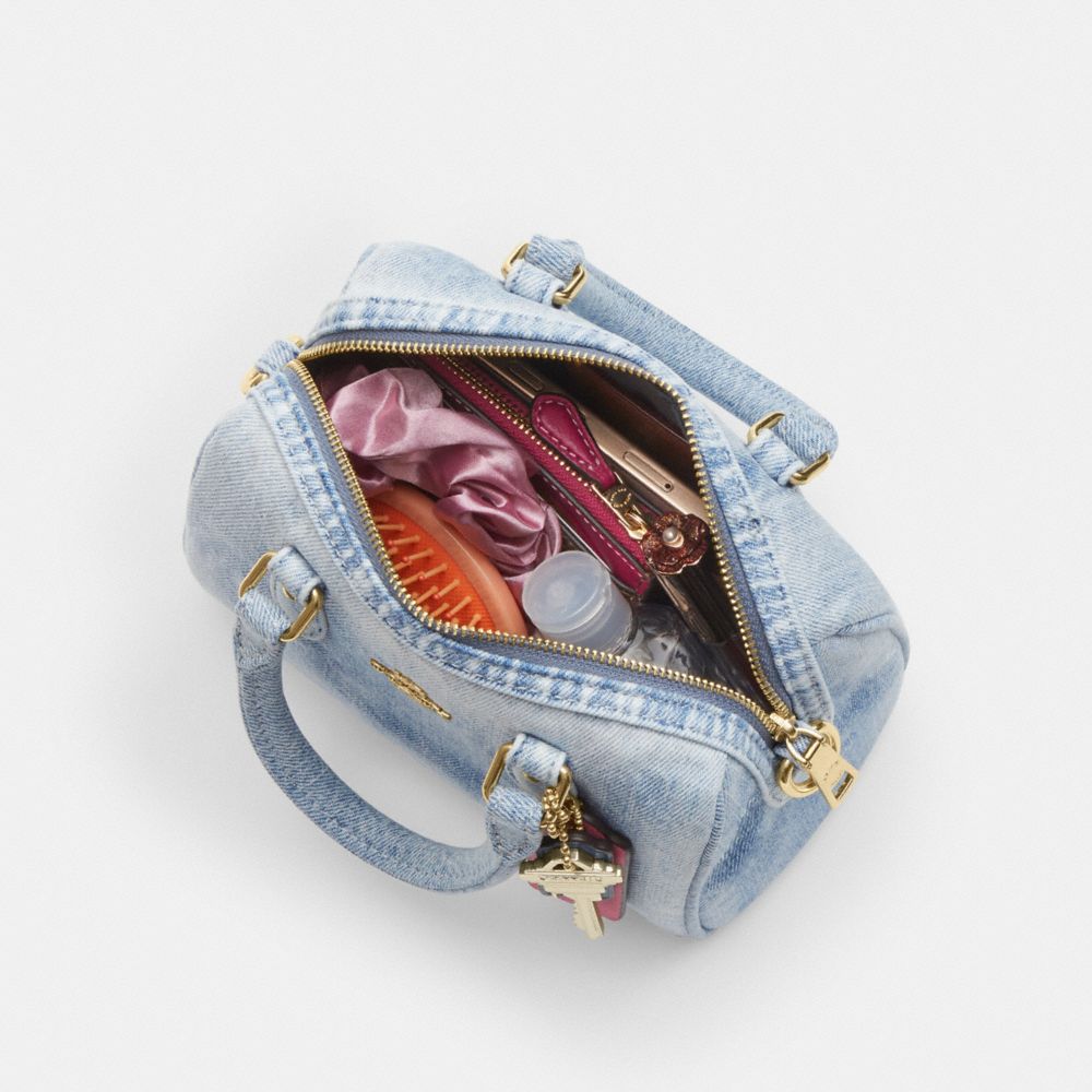 MINI ROWAN CROSSBODY BAG IN LOVED DENIM WITH CHARMS
