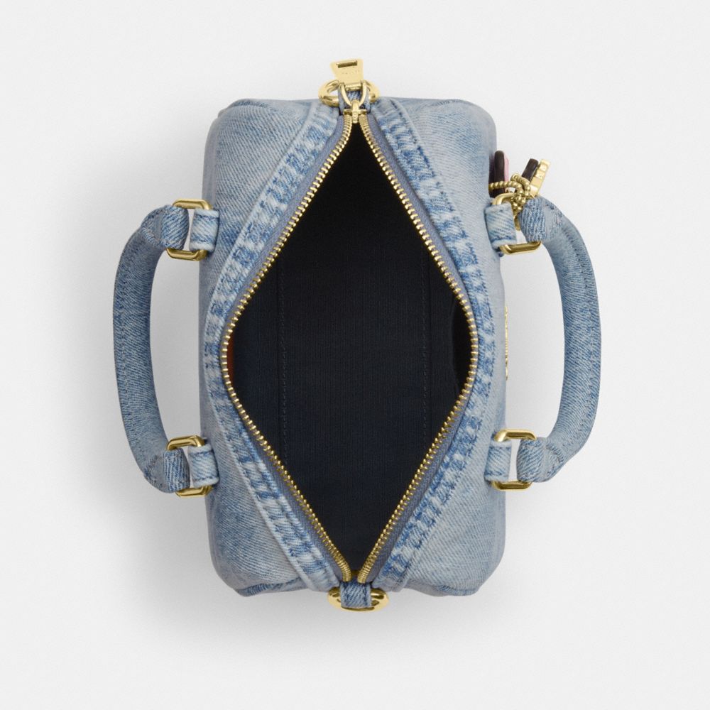 MINI ROWAN CROSSBODY BAG IN LOVED DENIM WITH CHARMS
