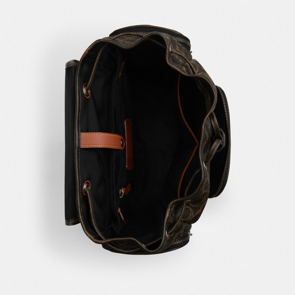FINN BACKPACK IN LOVED SIGNATURE CANVAS