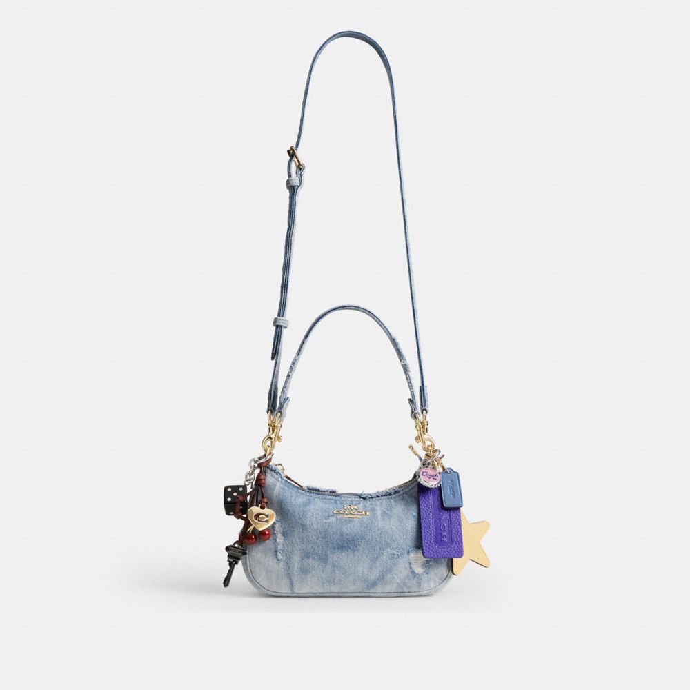 TERI SHOULDER BAG IN LOVED DENIM WITH CHARMS