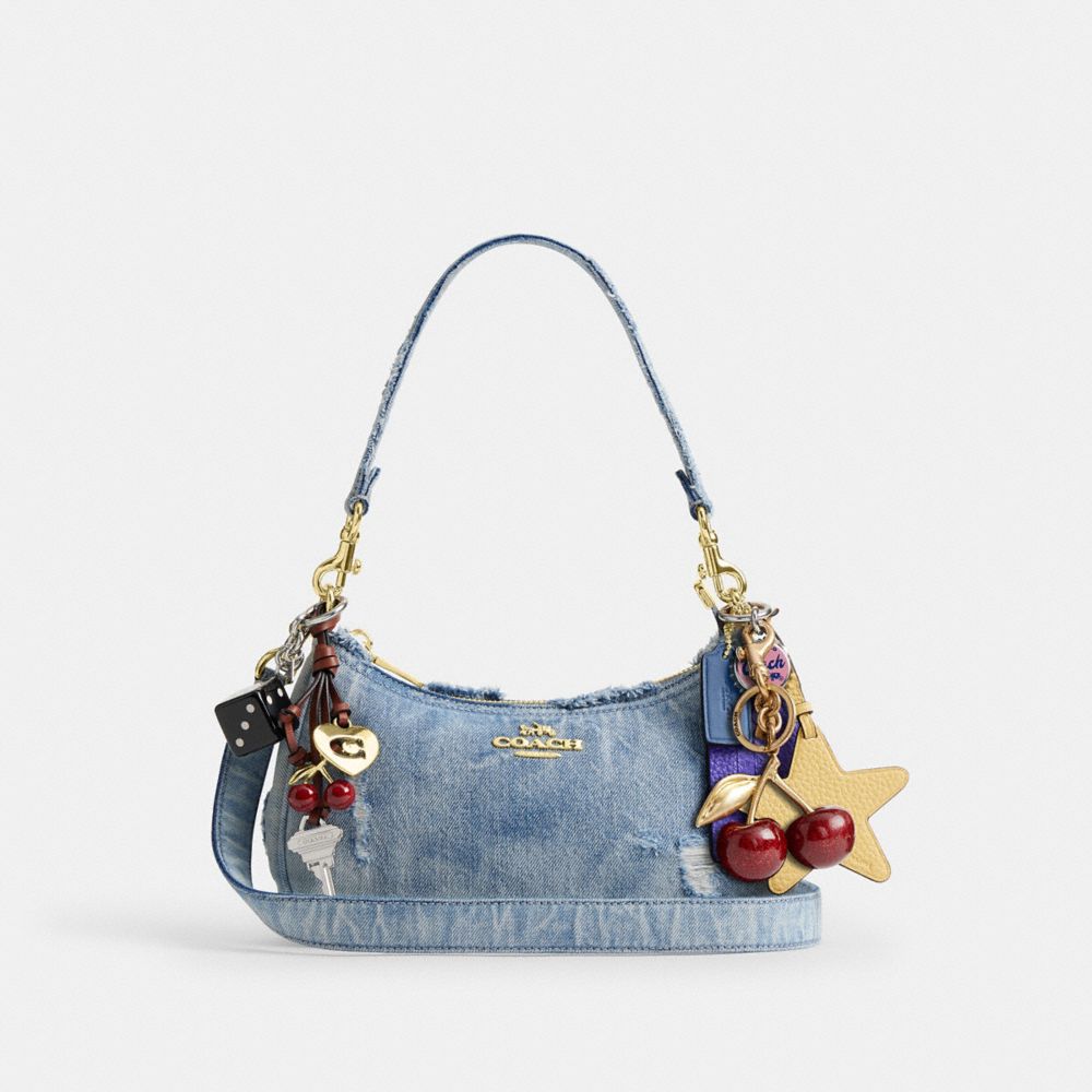 TERI SHOULDER BAG IN LOVED DENIM WITH CHARMS