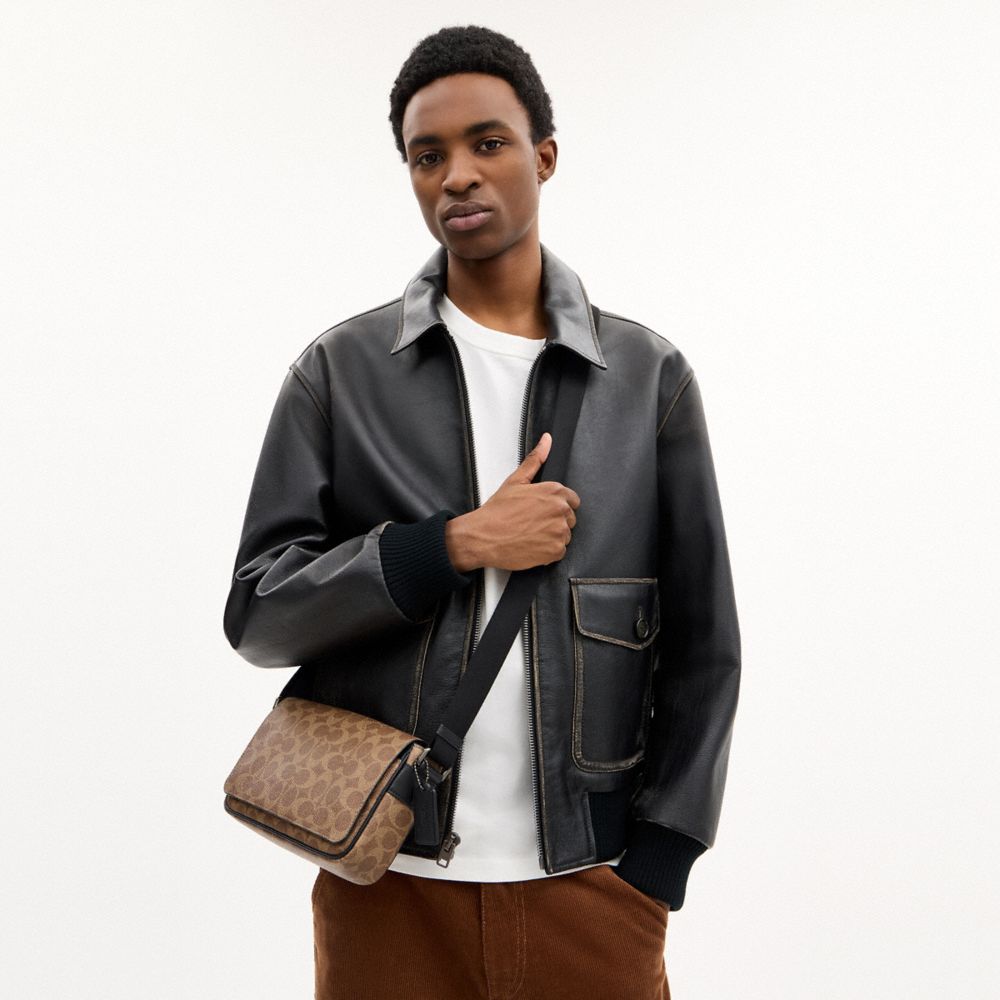JACK SMALL FLAP CROSSBODY BAG IN SIGNATURE CANVAS