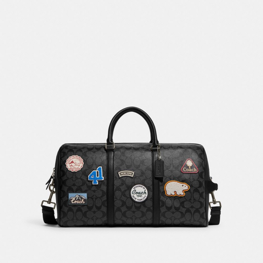 COACH CE553 Venturer Bag In Signature Canvas With Ski Patches GUNMETAL/CHARCOAL/BLACK MULTI