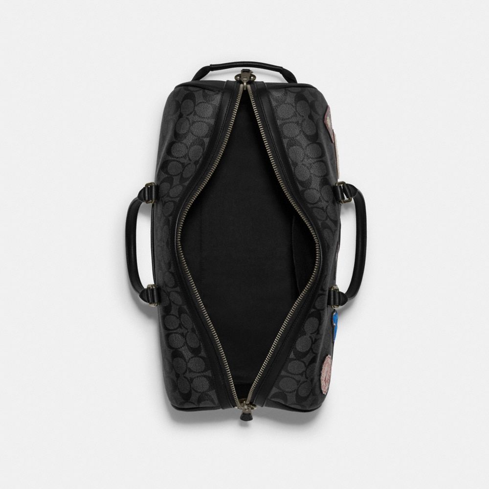 VENTURER BAG IN SIGNATURE CANVAS WITH SKI PATCHES