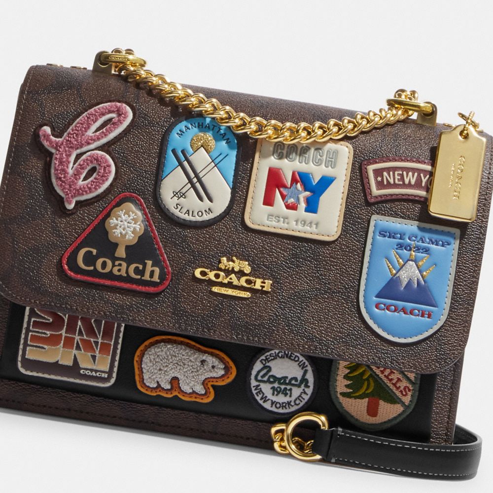 KLARE CROSSBODY IN SIGNATURE CANVAS WITH SKI PATCHES