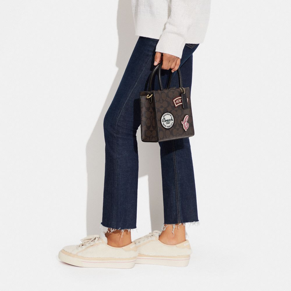 MINI CALLY CROSSBODY IN SIGNATURE CANVAS WITH SKI PATCHES