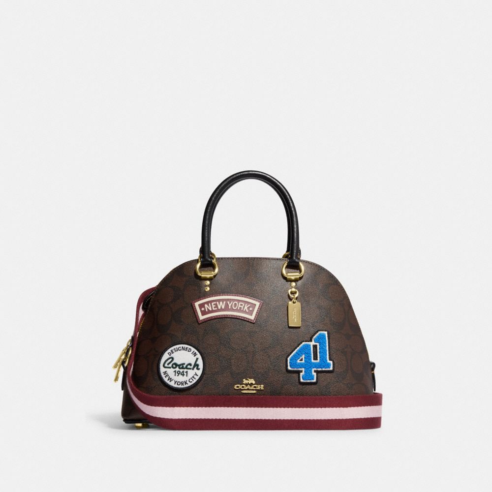 COACH CE594 Katy Satchel In Signature Canvas With Ski Patches Gold/Brown Black Multi