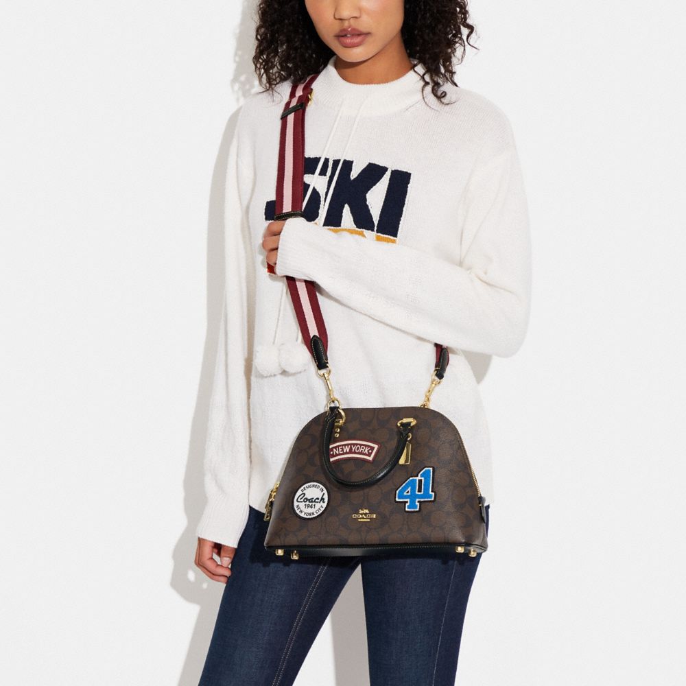 KATY SATCHEL IN SIGNATURE CANVAS WITH SKI PATCHES