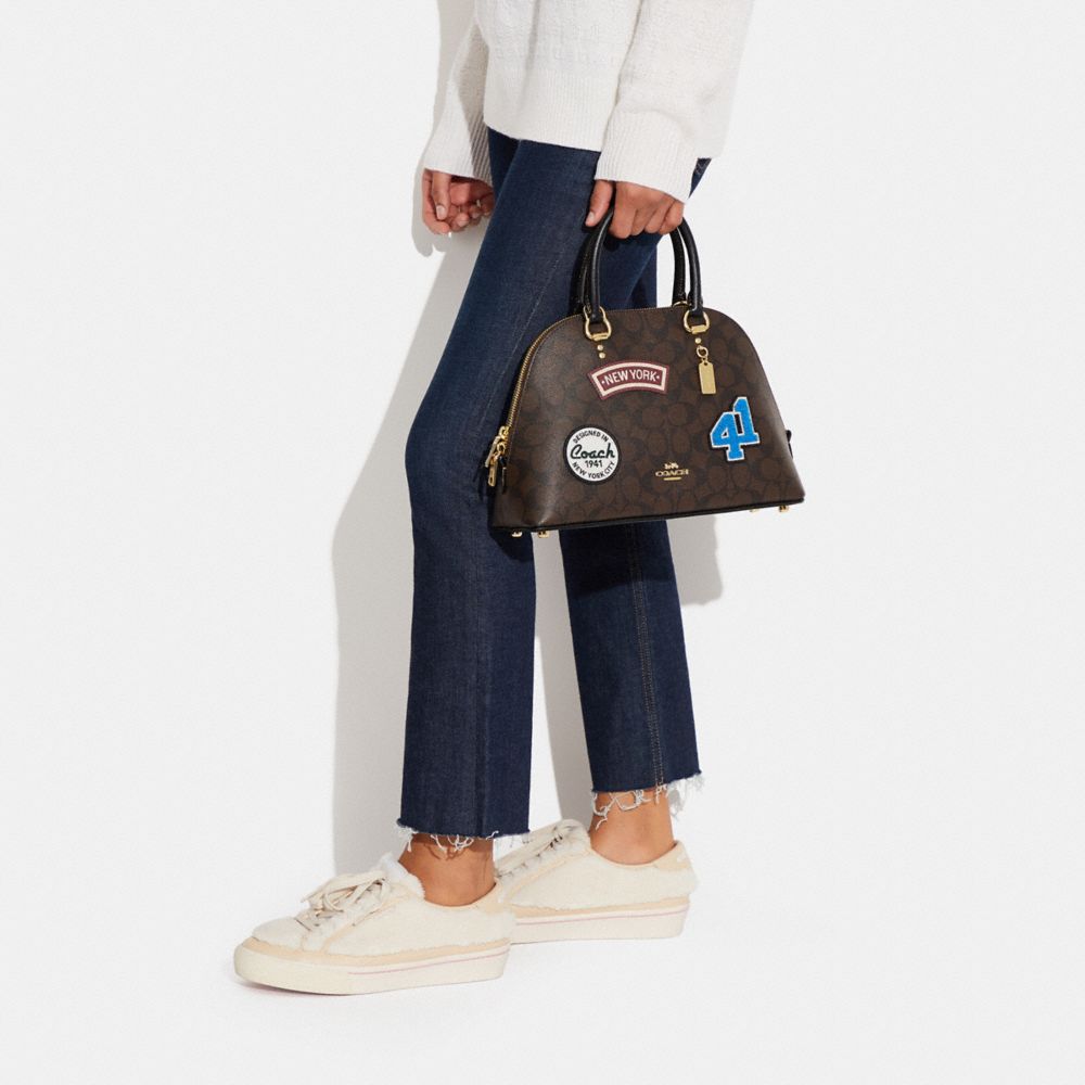 KATY SATCHEL IN SIGNATURE CANVAS WITH SKI PATCHES
