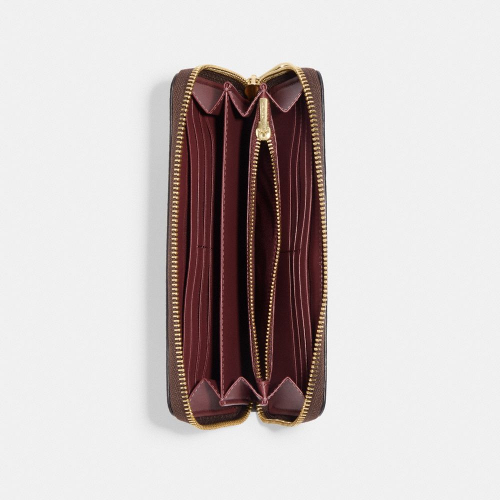 LONG ZIP AROUND WALLET IN SIGNATURE CANVAS WITH SKI PATCHES