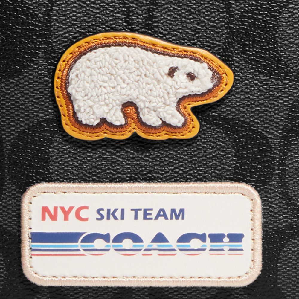 3-IN-1 WALLET IN SIGNATURE CANVAS WITH SKI PATCHES