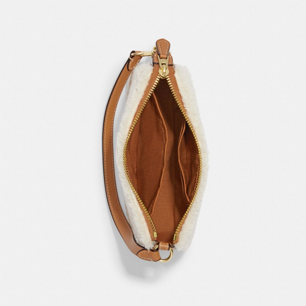 NOLITA 19 IN SHEARLING WITH COACH MOTIF