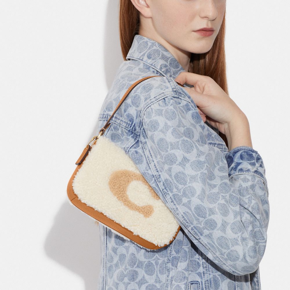 NOLITA 19 IN SHEARLING WITH COACH MOTIF