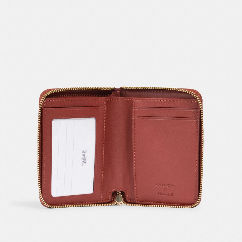 COACH X PEANUTS SMALL ZIP AROUND WALLET IN SIGNATURE CANVAS WITH SNOOPY WOODSTOCK PRINT