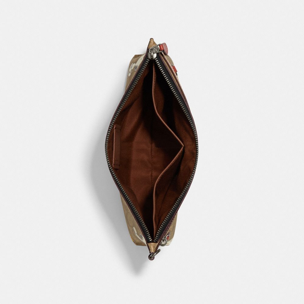 COACH X PEANUTS CARRY ALL POUCH IN SIGNATURE CANVAS WITH SNOOPY WOODSTOCK PRINT