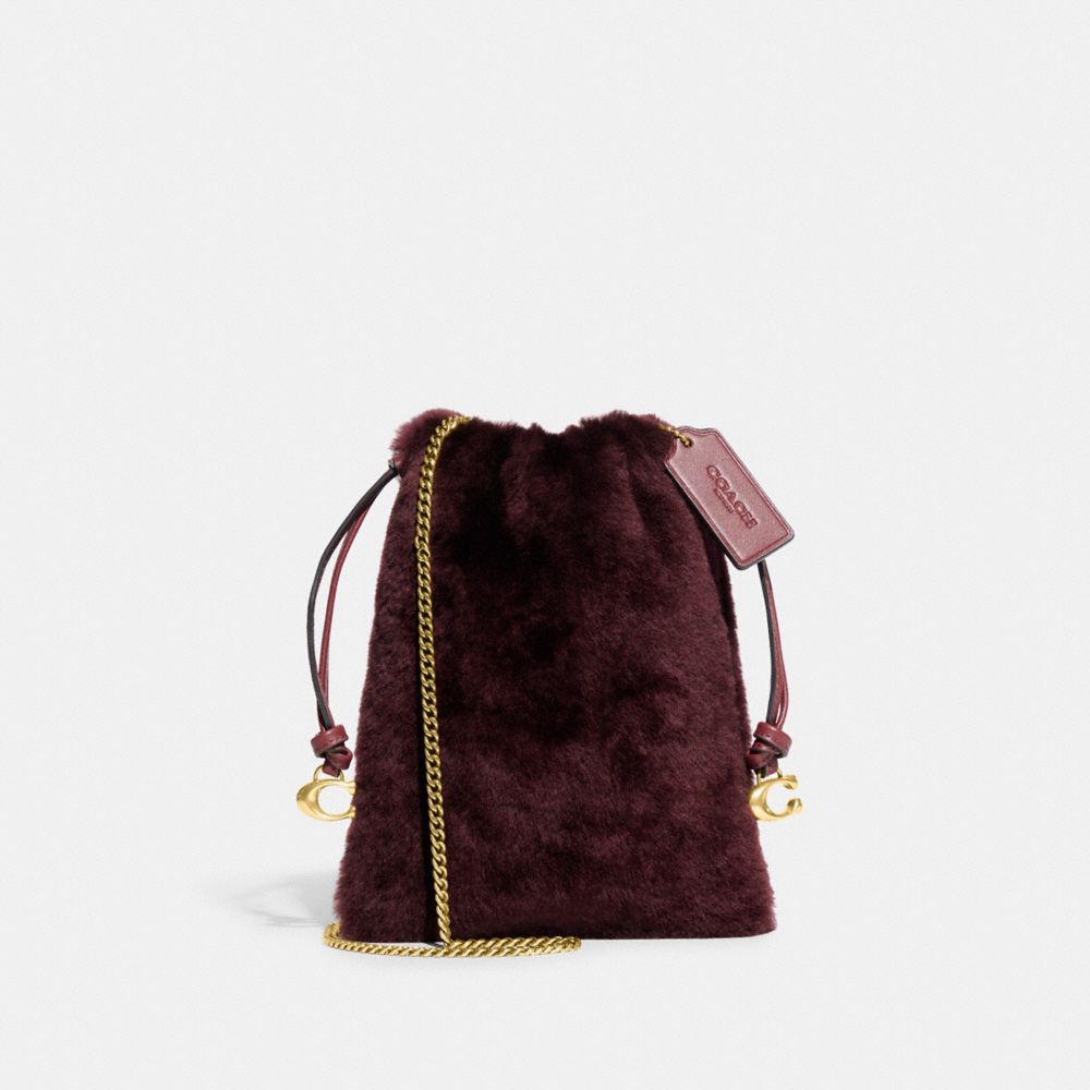 COACH CE759 Drawstring Pouch In Shearling Brass/Sangria