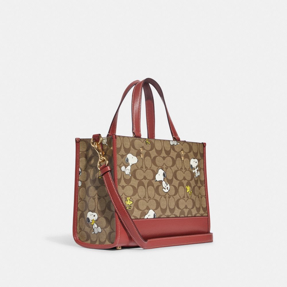 COACH X PEANUTS DEMPSEY CARRYALL IN SIGNATURE CANVAS WITH SNOOPY WOODSTOCK PRINT