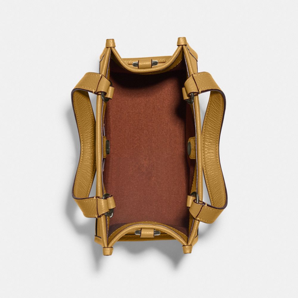 COACH X PEANUTS DEMPSEY TOTE 22 WITH SNOOPY PRESENT MOTIF