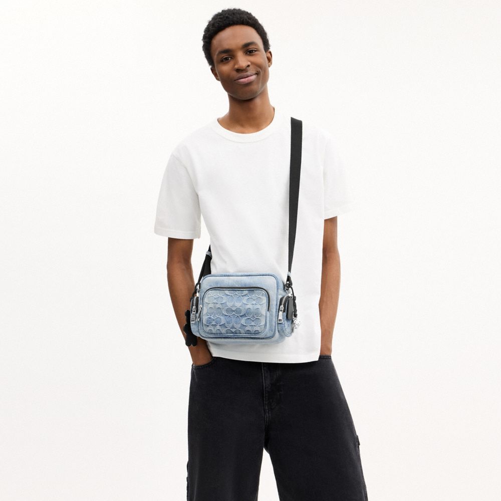 FLETCHER CROSSBODY BAG IN LOVED SIGNATURE DENIM