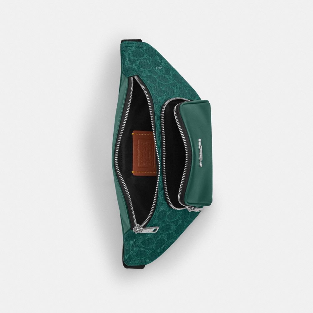 RACER SMALL BELT BAG IN SIGNATURE CANVAS