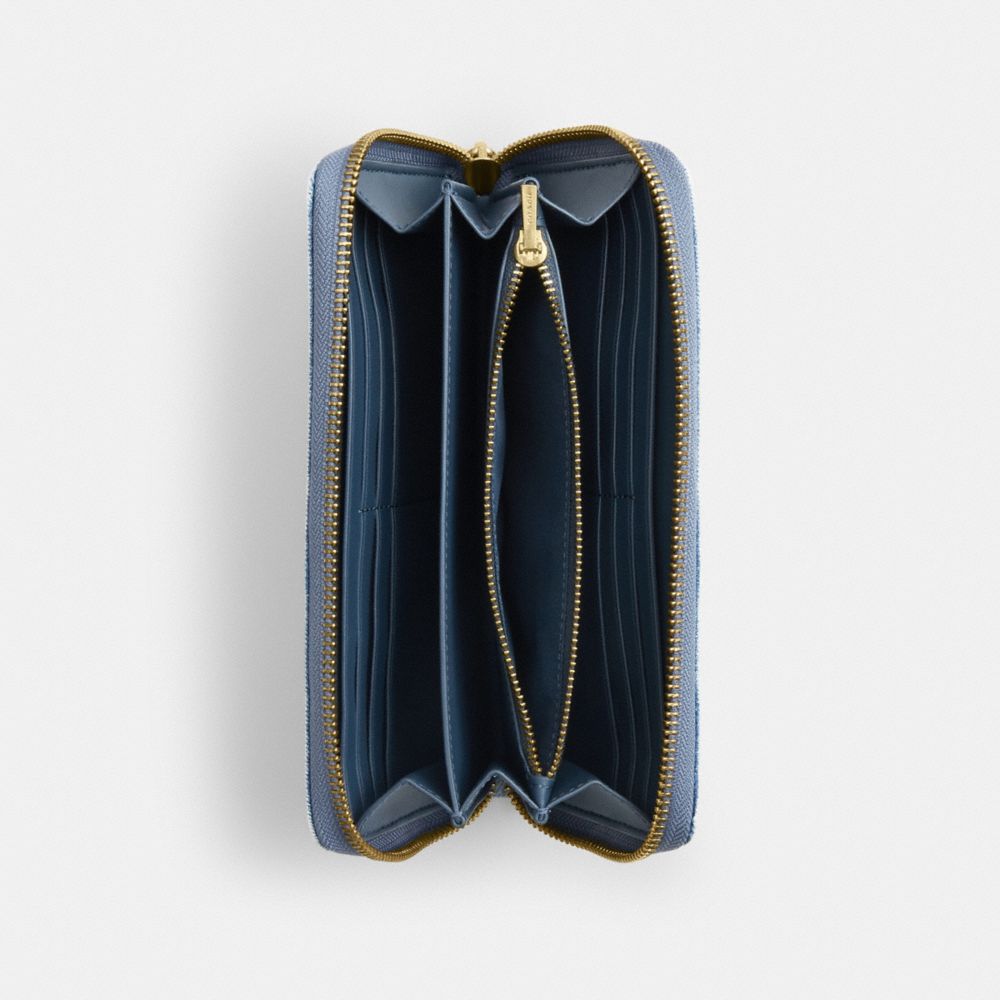 LONG ZIP AROUND WALLET IN LOVED DENIM
