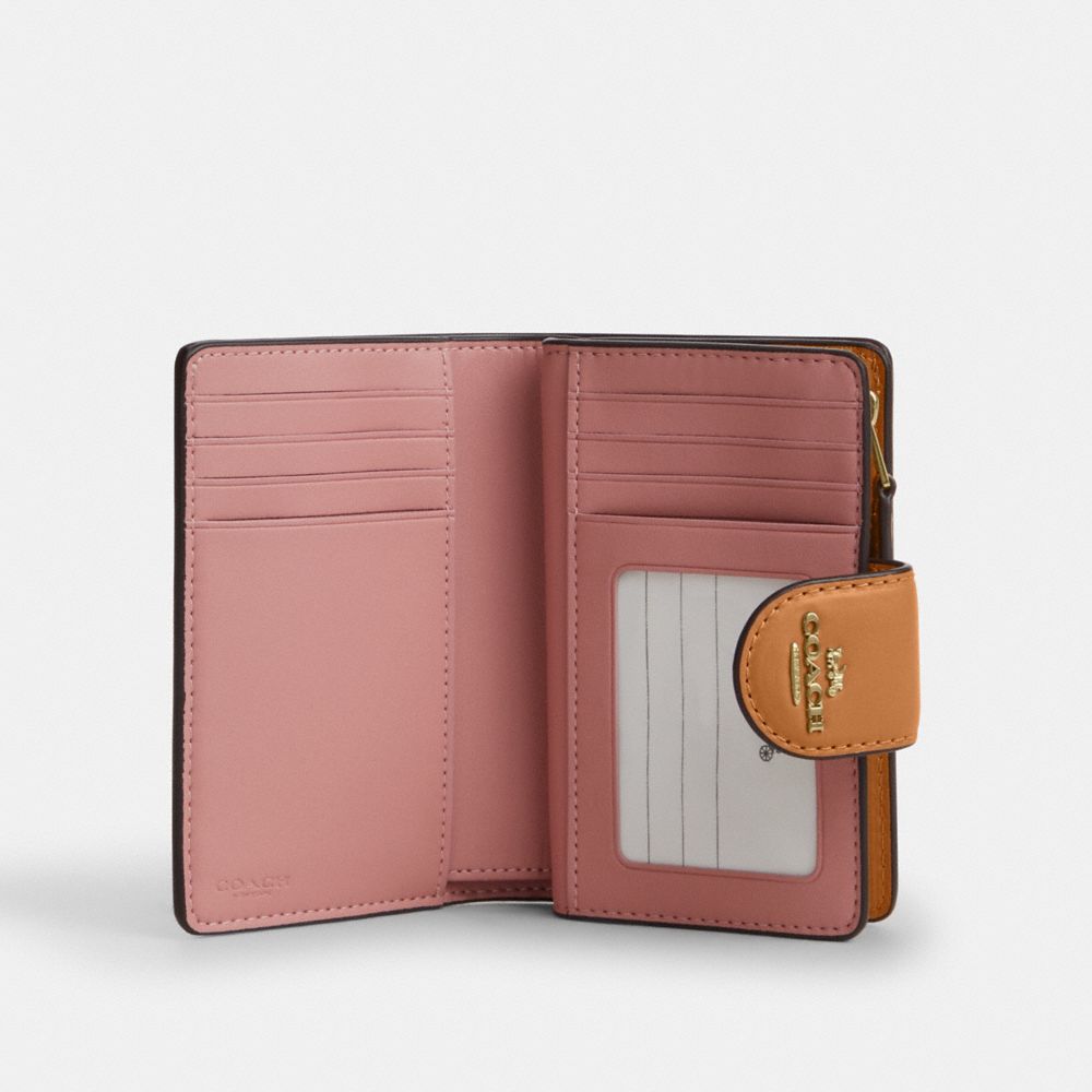 MEDIUM CORNER ZIP WALLET IN SIGNATURE CANVAS