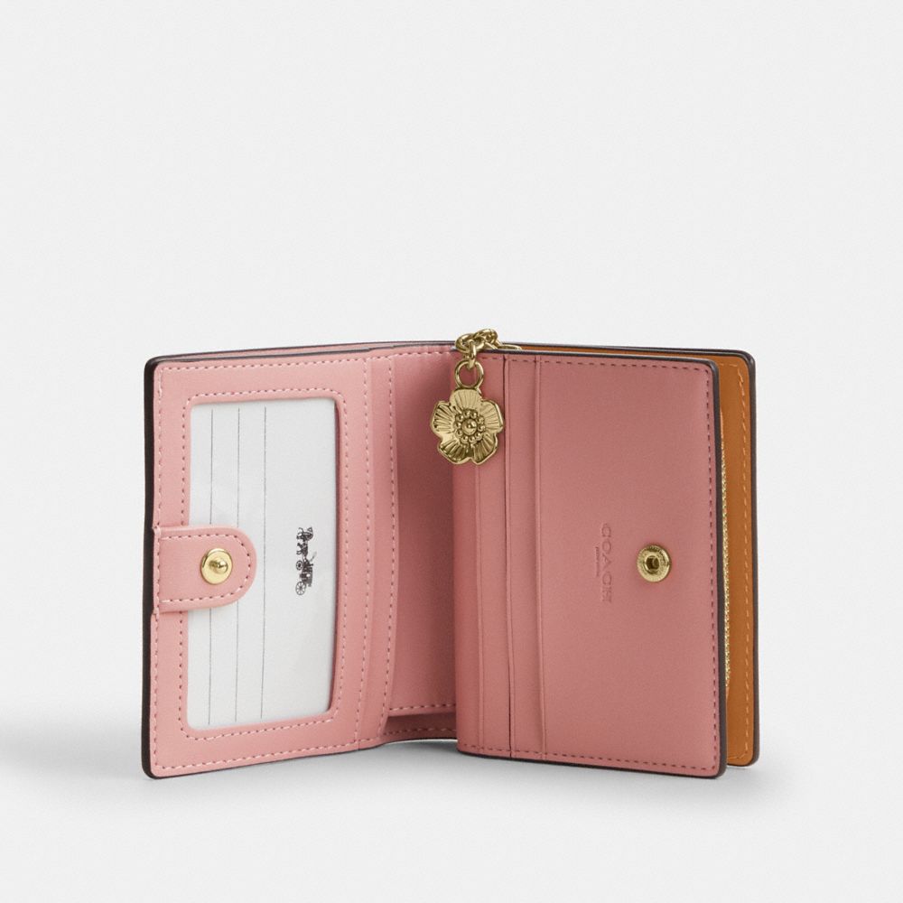 SNAP WALLET IN SIGNATURE CANVAS WITH CHARM