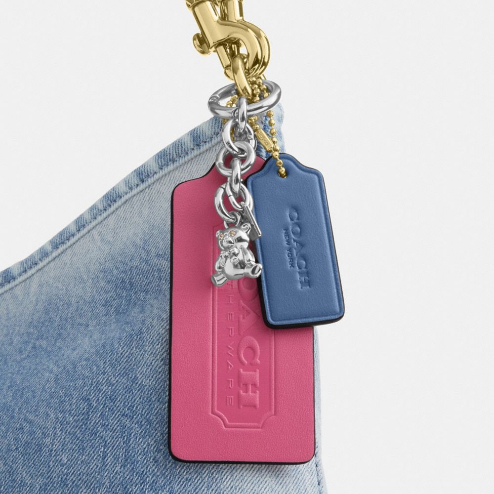 LAUREL SHOULDER BAG IN LOVED DENIM WITH CHARMS