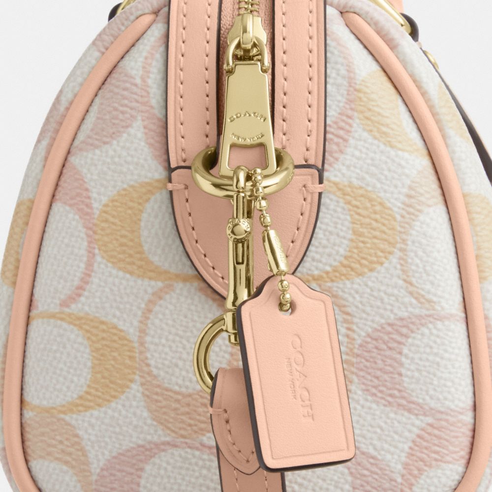 MINI ROWAN CROSSBODY BAG IN PRETTY SIGNATURE CANVAS