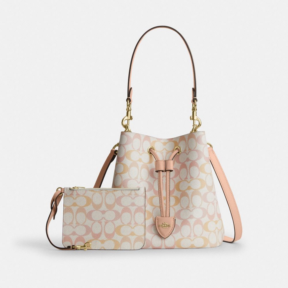 ROWAN BUCKET BAG IN PRETTY SIGNATURE CANVAS